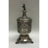 An unusual Continental silver cup and cover mounte