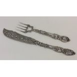 A pair of attractive Victorian silver fish servers