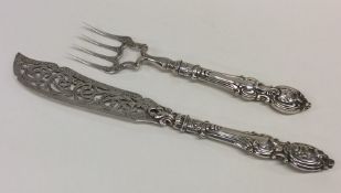 A pair of attractive Victorian silver fish servers