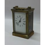 A small oak cased carriage clock with white enamel