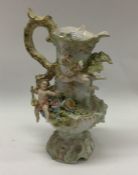 An attractive porcelain ewer decorated with winged