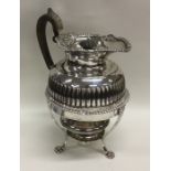 A good quality silver half fluted water jug on sta
