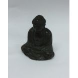 A heavy brass mounted model of a seated Buddha. Se