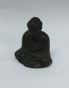 A heavy brass mounted model of a seated Buddha. Se