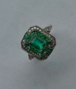 A good platinum mounted emerald and diamond Art De