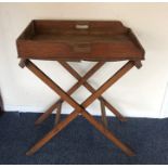 An old butler's tray on stand. Est. £30 - £50.
