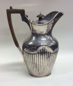 A silver half fluted water jug. London. By LAW. Ap