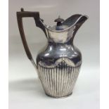 A silver half fluted water jug. London. By LAW. Ap