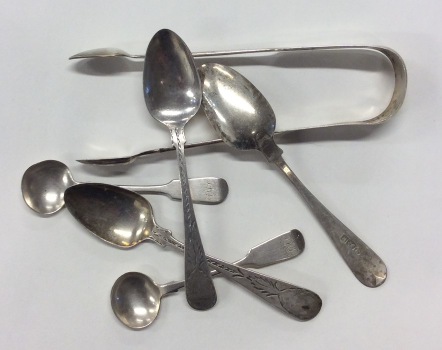 EXETER: A pair of silver sugar tongs, cruet spoons