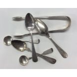 EXETER: A pair of silver sugar tongs, cruet spoons