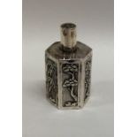 A Chinese silver miniature tea caddy with floral d