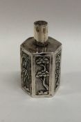 A Chinese silver miniature tea caddy with floral d