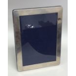 A modern silver picture frame with velvet back. Lo