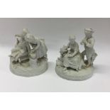 Two parian figures of children on scroll bases. Es