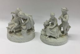 Two parian figures of children on scroll bases. Es