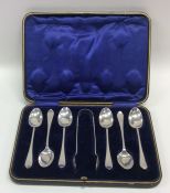 A boxed set of six Edwardian silver teaspoons toge