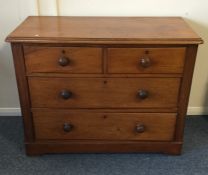 A mahogany flat front chest of four drawers. Est.