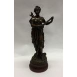 A large spelter figure of a lady playing a mandoli