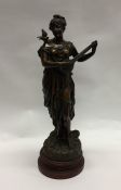 A large spelter figure of a lady playing a mandoli