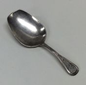 An Antique Russian silver caddy spoon decorated wi