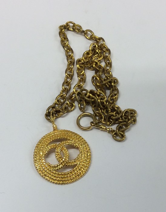 CHANEL: A massive gold plated pendant on chain. Es - Image 2 of 2