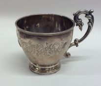 A French silver engraved cup with tapering body. A