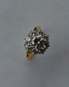 A large circular diamond daisy head cluster ring s