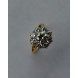 A large circular diamond daisy head cluster ring s