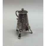 A novelty miniature silver table toy in the form o
