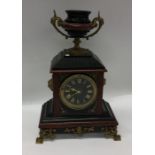 A stylish slate clock with brass mounts. Est. £50