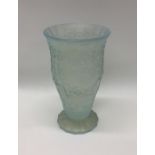A stylish opaque glass vase with floral decoration
