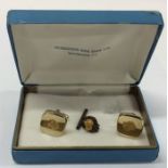 A pair of gold nugget mounted cufflinks together w