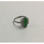 An Art Deco jade and diamond nine stone ring in pl