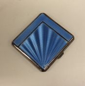 An Art Deco silver and blue enamel cigarette case.