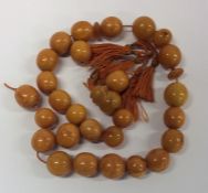 A good string of cylindrical yellow amber beads. A