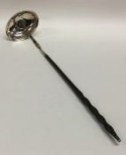 A Georgian silver plain toddy ladle with whalebone