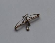 An attractive two colour gold brooch in the form o