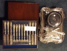 A quantity of silver plated cutlery, entrée dishes