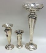 A group of three tapering silver spill vases. Appr