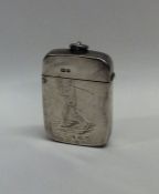 A Victorian silver hinged top vesta case decorated