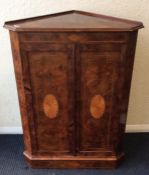 An attractive Victorian burr walnut corner cupboar