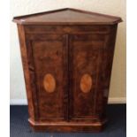 An attractive Victorian burr walnut corner cupboar