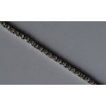 A good diamond line bracelet in white gold mount w