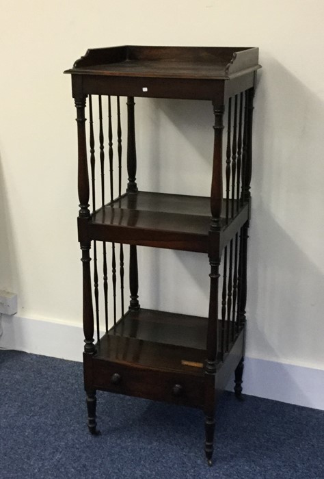 A rosewood buffet on turned supports. Est. £60 - £