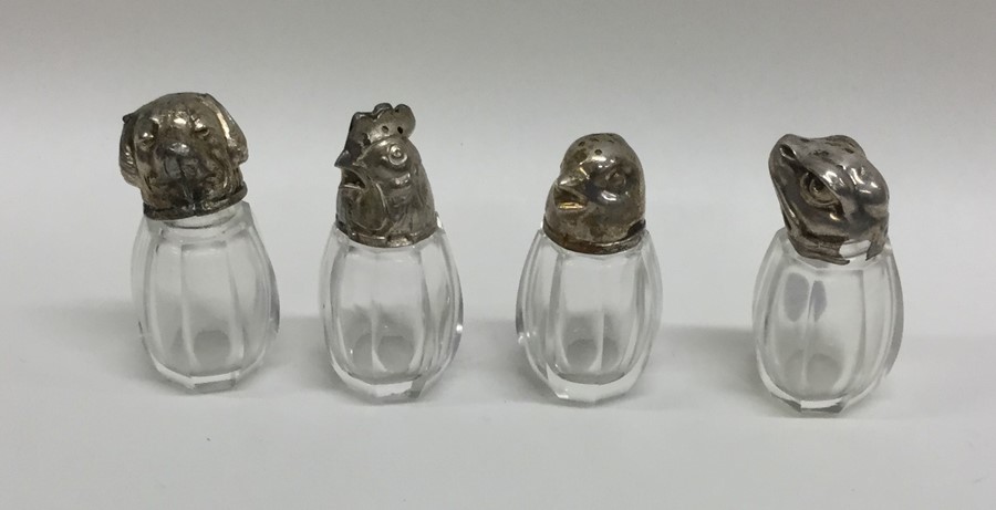 A set of four silver mounted novelty peppers. Appr