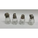 A set of four silver mounted novelty peppers. Appr