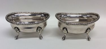 A heavy pair of Continental silver butter dishes w