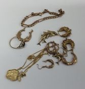 A collection of gold earrings, bracelets, pendants
