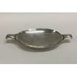An oval silver sweet dish on pedestal foot. Approx