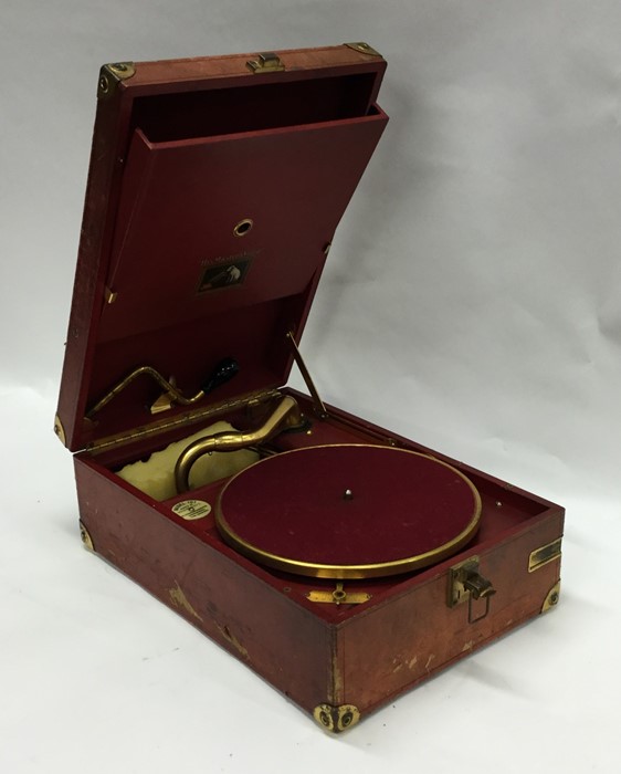 An old travelling 'HMV' record player. Est. £20 -